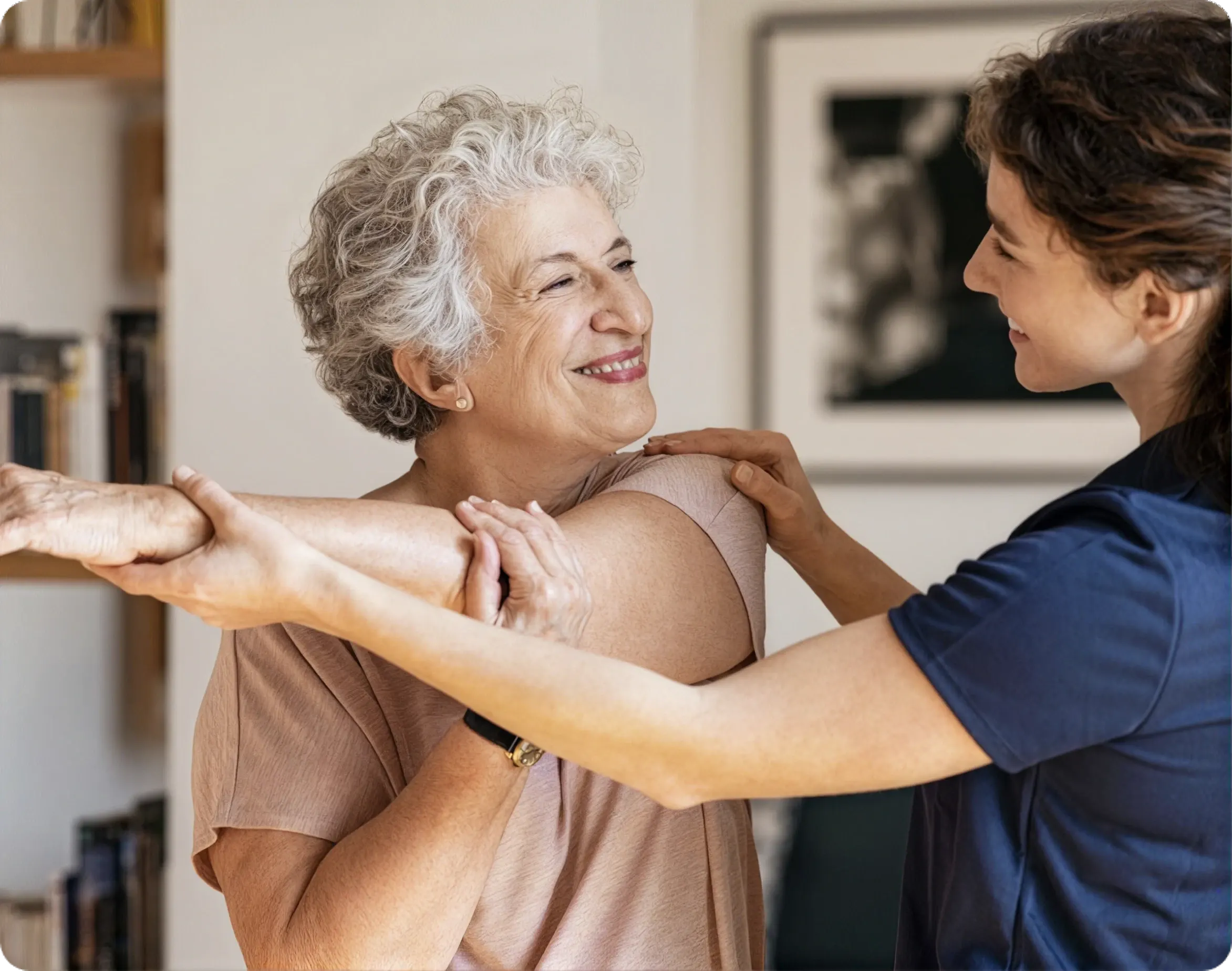 A Vivo Healthcare therapist supporting a resident through a stretch
